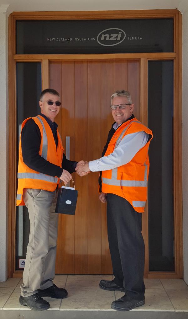 Peter Quested receives a 25 Year gold watch from Chris van der Werff, July 2017